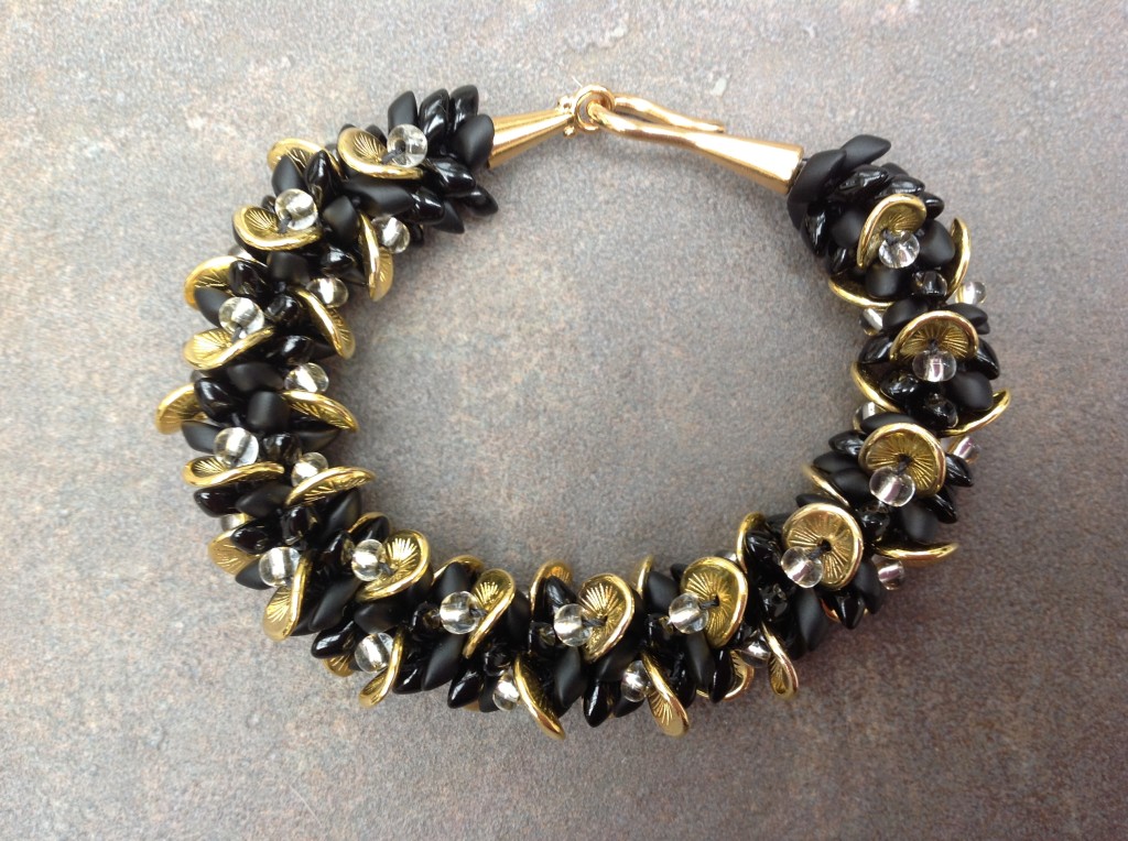 Kumihimo bracelet made with wavy disk beads